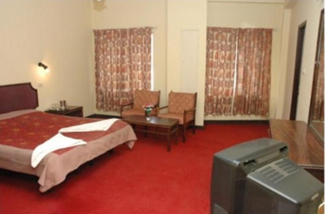 Hotel Preethi Palace Ooty Rum bild